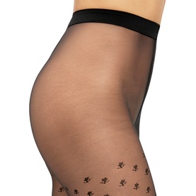 Model wearing Wolford black sheer tights with floral rose motif detail at the thigh and wide comfort waistband.