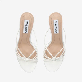 Steve Madden white strappy heeled mule sandals with crossover straps and slim block heel, top-down view