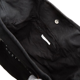 Seafolly Ship Sail Tote Bag in black, interior view showing black canvas lining, zip pocket, and silver snap fastener detail.