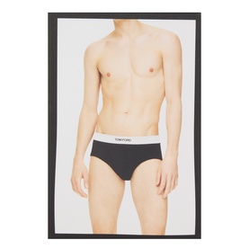 Model wearing Tom Ford Briefs in black with white branded elasticated waistband.