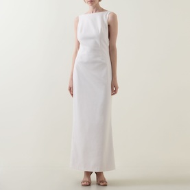 Model wearing Anne Louise Boutique Rose Bow Dress in Rose, sleeveless maxi with high neckline, styled with strappy sandals