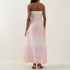 Model wearing Bernadette Dress in Spanish Seaside, strapless ombr&eacute; maxi style fading from ivory to soft pink, shown from the back