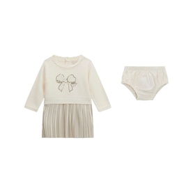Cream knit baby dress with bow motif and pleated skirt, shown with matching cream bloomers