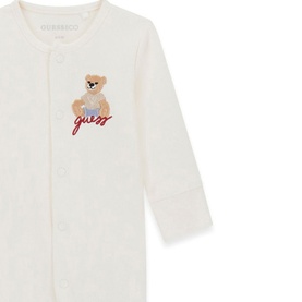 Guess cream baby sleepsuit with embroidered teddy bear and script logo on chest, snap fastening front