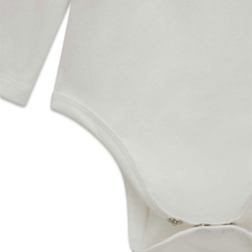 Guess cream white 3-piece children's set, close-up detail of soft fabric bodysuit with snap fastening at base