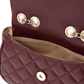 Guess deep maroon quilted mini bag, open top view showing gold-tone chain strap and beige satin interior lining.