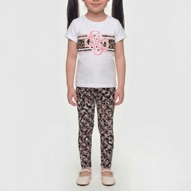 Model wearing Guess Animalier 4G Pink Leggings with matching white graphic tee and beige shoes