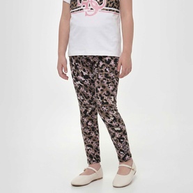 Model wearing Guess Leggings in Animalier 4G Pink floral-animal print. Styled with white graphic tee and white Mary Jane shoes.