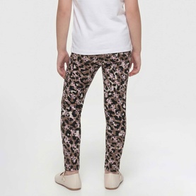 Model wearing Guess Leggings in Animalier 4G Pink, styled with a white tee and light shoes, rear view