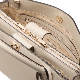 Guess light taupe satchel interior view showing multiple zip compartments, slip pockets and gold-tone hardware detailing