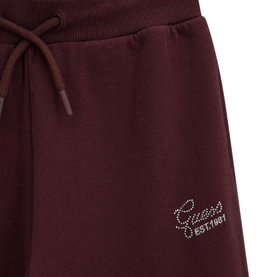 Guess Est.1981 burgundy fleece joggers with rhinestone logo detail and drawstring waistband, close-up view