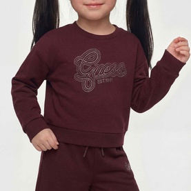 Model wearing Guess Deep Maroon sweat top with rhinestone logo, styled with matching maroon joggers
