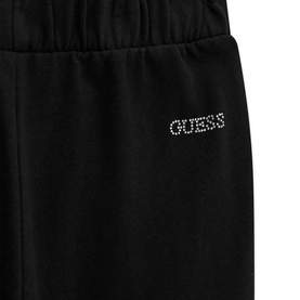 Guess black joggers with crystal rhinestone logo detail on waistband, elasticated waist, close-up view