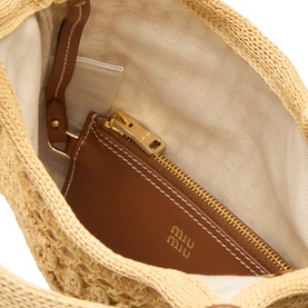 Miu Miu Natural raffia tote bag interior showing tan leather zip pouch with gold-tone hardware and branded logo detail