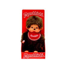 Monchhichi brown plush monkey toy with red and white chequered bib, displayed in branded red packaging box.