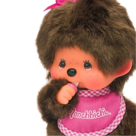 Monchhichi pink plush toy with brown fur, pink gingham bib, pink bow, finger-to-mouth pose, medium size