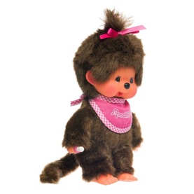 Monchhichi brown plush monkey toy with pink bow and pink branded bib, seated pose with long tail visible
