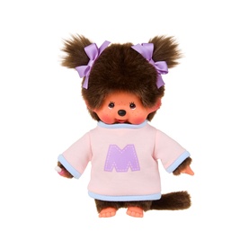 Monchhichi plush toy with brown fur, pink sweatshirt with M logo, purple hair bows, and a curly tail