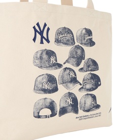 New Era New York Yankees MLB Cap Graphic Tote Bag in beige cotton canvas, featuring navy NY logo and illustrated cap array graphic print