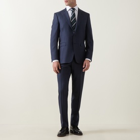 Model wearing Canali D8 Two-Piece Suit in navy wool, styled with white shirt and striped tie, paired with black leather shoes.