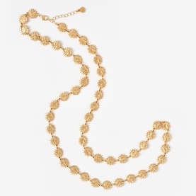 Mint Velvet gold tone long link necklace featuring repeating textured sunburst disc charms, shown doubled