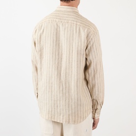 Model wearing NN07 Deon Linen Striped Shirt in Black Stripe, rear view showing long sleeves, buttoned cuffs and curved hem.
