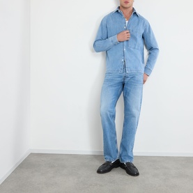 Model wearing NN07 Blue Denim casual shirt with matching light wash jeans and black loafers