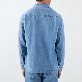 Model wearing NN07 blue denim casual shirt, rear view, relaxed fit with long sleeves and curved hem, 100% cotton