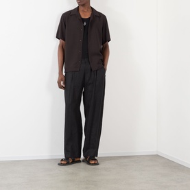 Model wearing NN07 Dusky Port casual shirt with black trousers and brown leather sandals