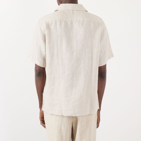 Model wearing NN07 Julio Linen Shirt in Oat, rear view showing short sleeves and straight hem, styled with matching oat linen trousers.