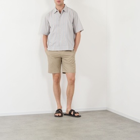 Model wearing NN07 Red Stripe cotton casual shirt with khaki shorts and dark brown sandals