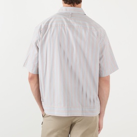 Model wearing NN07 red stripe cotton casual shirt, short sleeves, camp collar, styled with beige trousers. Rear view.