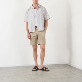 Model wearing NN07 Red Stripe cotton casual shirt with beige chino shorts and black leather sandals.