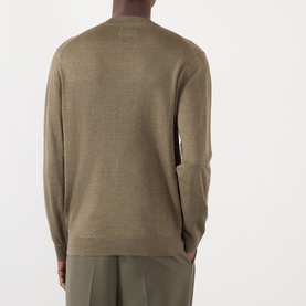 Model wearing NN07 Ted Linen Knitted Sweater in Capers, shown from the back, with olive trousers. Crew neck, long sleeves, ribbed trims.