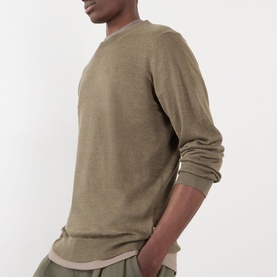 Model wearing NN07 Ted Linen Knitted Sweater in Capers, crew neck, long sleeves, styled with matching olive trousers