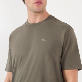 Model wearing NN07 T-shirt in Capers green, crew neck, short sleeves, small chest logo, relaxed fit, 100% cotton.