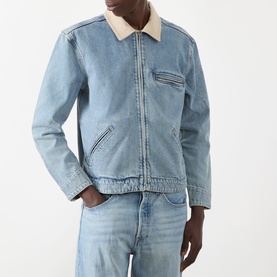 Model wearing Paige Laughlin Acid Wash Denim Jacket in Moby, with cream brushed twill collar, front zip, chest pocket, styled with denim jeans