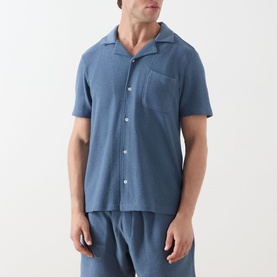 Model wearing Paige Oliver Patch Pocket Casual Shirt in Lakeside blue, short sleeves, camp collar, chest pocket, styled with matching trousers