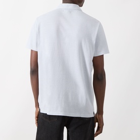 Model wearing Paige Demille Solid Polo Shirt in Bristol Blue Combo, back view, piqu&eacute; cotton with flat collar and straight hem, styled with black