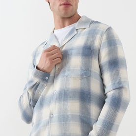 Model wearing Paige Kransey Check Casual Shirt in Shadow Plaid, blue and cream check, revere collar, long sleeves, styled over white T-shirt
