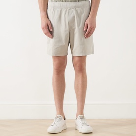 Model wearing Paige shorts in Shallow, elasticated waist, cotton blend, styled with white trainers