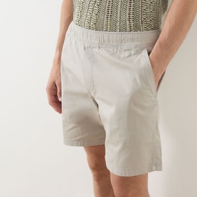 Model wearing Paige shorts in Shallow, elasticated waistband, lightweight cotton blend, styled with a knit top.