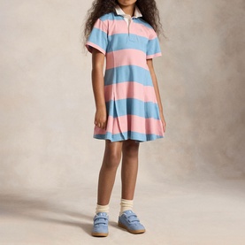 Model wearing Ralph Lauren Pony Logo Striped Rugby Dress in pink and blue stripes, fit-and-flare silhouette with polo collar
