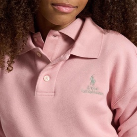 Model wearing Ralph Lauren Pony Logo Terry Polo Sweatshirt in Light Pink with embroidered pony and script logo on chest, ribbed polo collar,