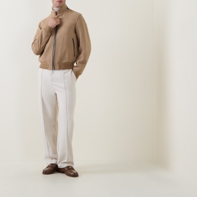 Model wearing Tom Ford Golden Brown virgin wool-silk casual jacket with zip fastening, styled with white trousers and brown loafers.