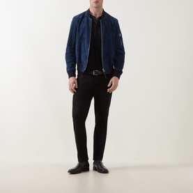Model wearing Tom Ford indigo suede casual jacket with black trousers, belt and leather shoes.