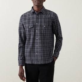 Model wearing Tom Ford grey cotton plaid casual shirt with dual chest pockets and snap buttons, styled with black trousers