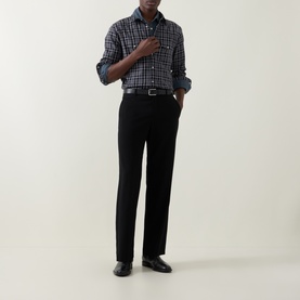 Model wearing Tom Ford grey cotton check casual shirt with black trousers and black leather loafers.