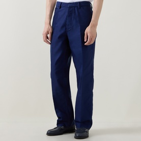 Model wearing Tom Ford Navy Blazer cotton casual trousers, styled with black leather shoes. Straight leg, relaxed fit.