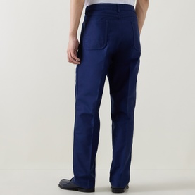 Model wearing Tom Ford Navy Blazer cotton casual trousers, rear view showing back pockets and relaxed straight-leg fit